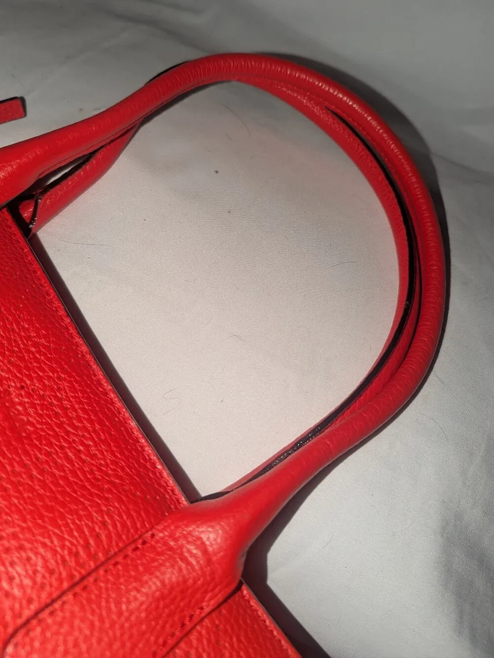 Kate Spade New York  Noel Rue Red Pebbled Perforated Leather Tote Bag.